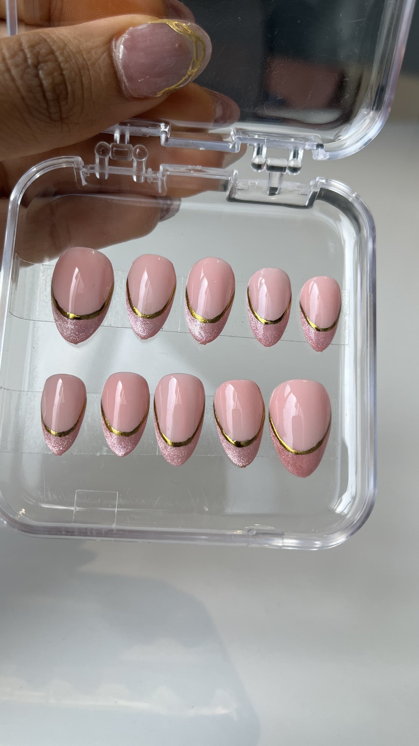 Chrome With Cate Eye Nail Art On A Milky Pink Background