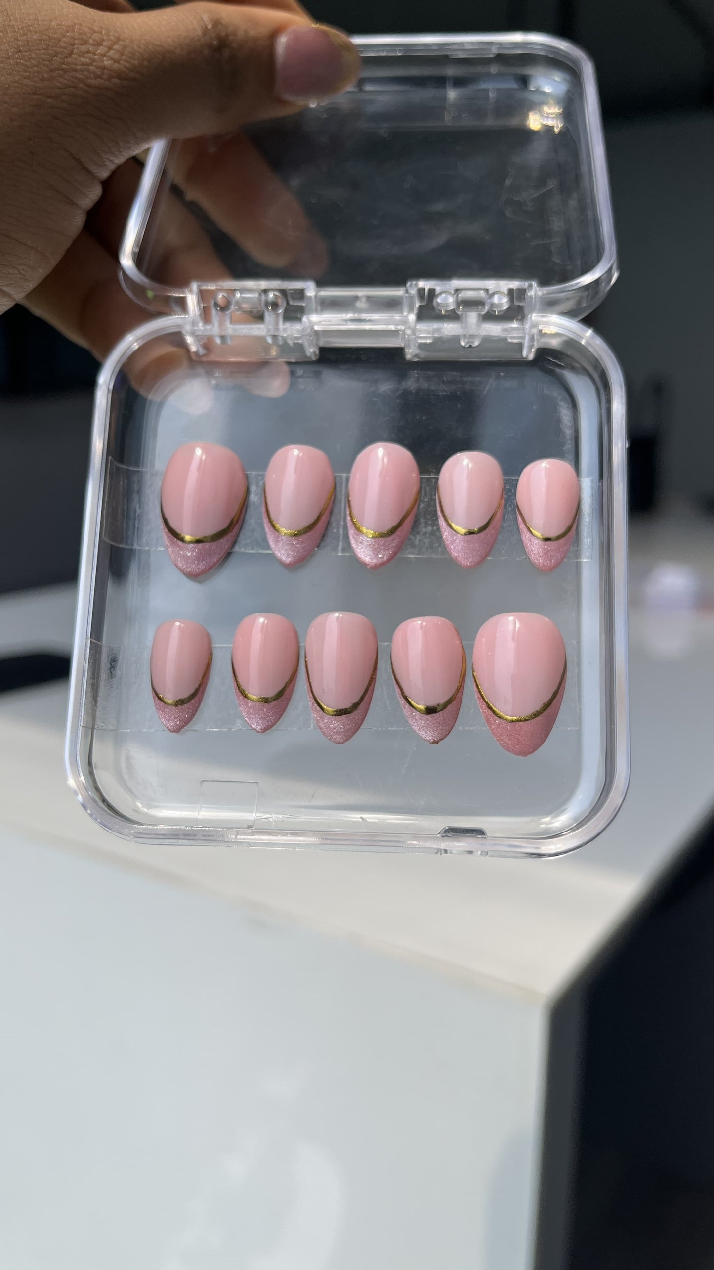 Chrome With Cate Eye Nail Art On A Milky Pink Background